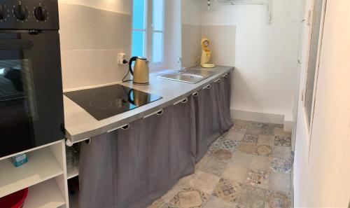 a kitchen with a sink and a counter top at Studio Calendal in Cassis