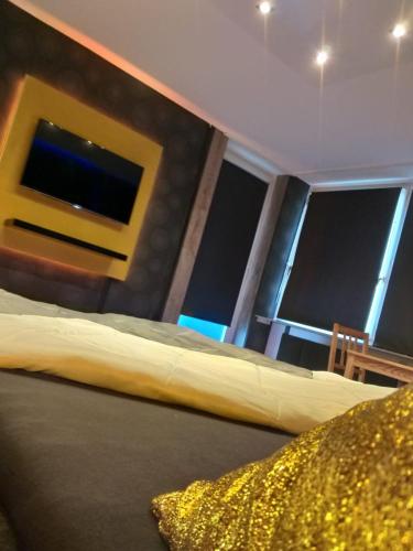 a bedroom with a bed in front of a window at modern Hoteliving Gießen in Gießen