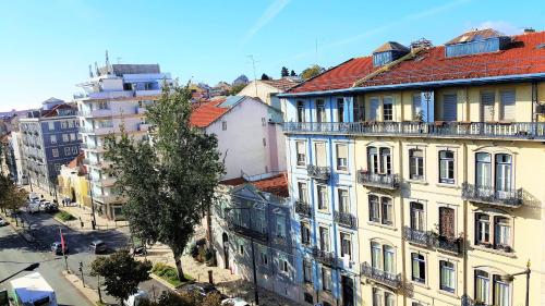 a group of buildings on a city street at Almirante 48 Two Bedroom in Lisbon