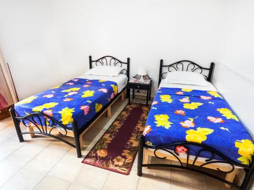 Ένα ή περισσότερα κρεβάτια σε δωμάτιο στο Chez Ali Apartments