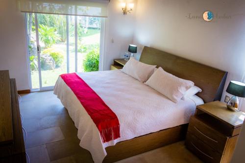 מיטה או מיטות בחדר ב-Finca Catalina Hotel Boutique