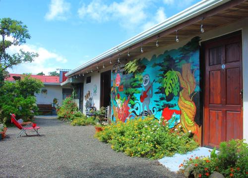 a building with a painting on the side of it at Casa Jungle Monteverde B&B in Monteverde Costa Rica