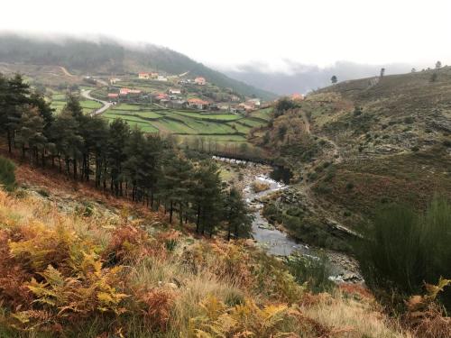 a view of a valley with a river on a hill at Refúgio dos Macedos in Bilhó