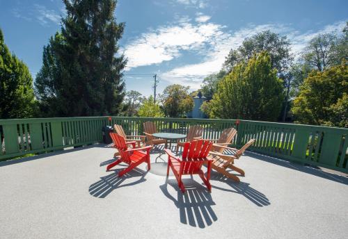 a group of chairs and a table on a patio at Robin Hood Inn and Suites in Victoria