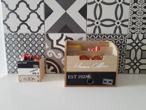 a wooden box with food in it next to a wall at Evmelia Kakopetria Suites in Kakopetria