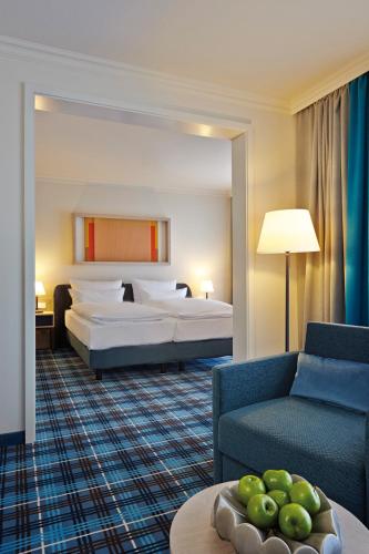 Ein Bett oder Betten in einem Zimmer der Unterkunft Aalernhüs hotel & spa