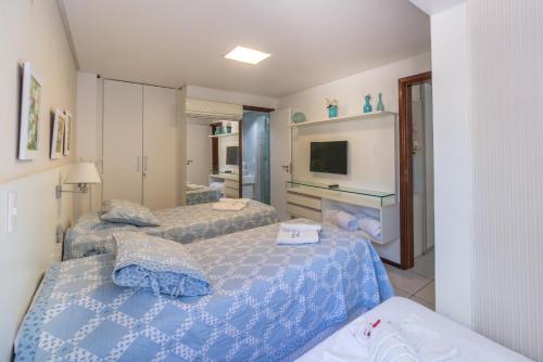 מיטה או מיטות בחדר ב-Condomínio Nannai Residence - Anchova 01