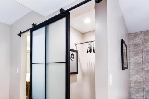 a glass door in a room with white walls at Hollywood Inn Suites Hotel in Los Angeles