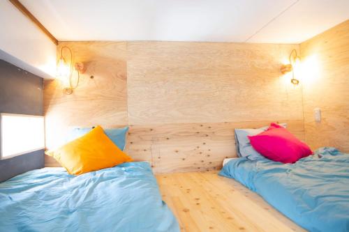 MEEDAFU'S YUI HOSTEL and COFFEEにあるベッド