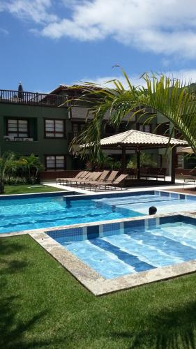 Poolen vid eller i närheten av Apartamento na Praia - KAUAI