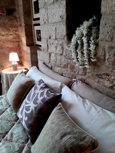 a group of pillows on a couch in a room at Case Brizi Assisi in Assisi