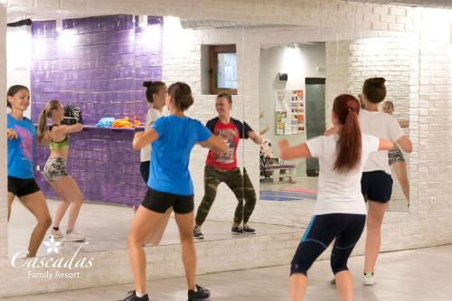 a group of people dancing in a dance class at Cascadas Family Resort in Sunny Beach