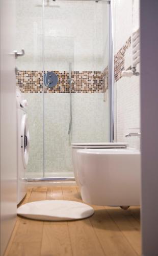 a bathroom with a shower and a tub and a toilet at La "Piccola" di Irene al Vaticano in Rome