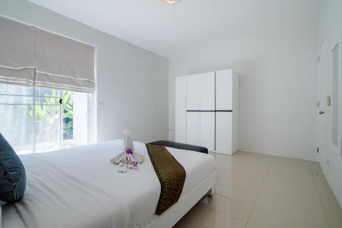 Ένα ή περισσότερα κρεβάτια σε δωμάτιο στο The Beach Village Resort
