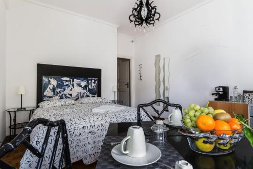 a bedroom with a bed with a bowl of fruit on a table at B&B Viale Dei Colli Portuensi 589 in Rome