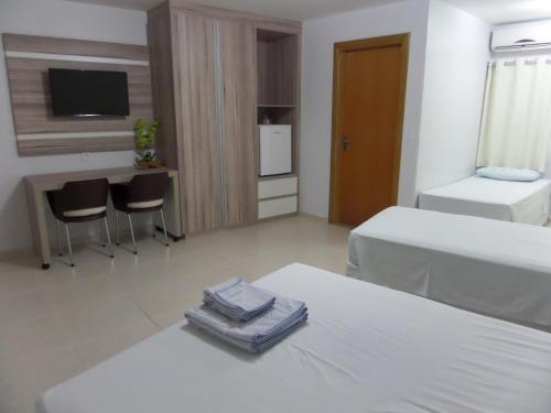 Cama ou camas em um quarto em Hotel CTC