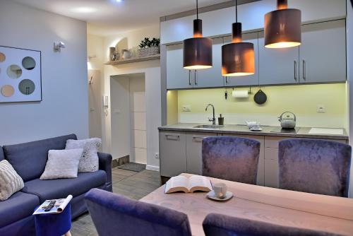 Kuchyňa alebo kuchynka v ubytovaní Apartamenty Sjesta Centrum