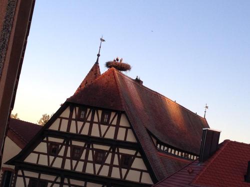 a building with a cross on the top of it at CasaNova in Bad Windsheim
