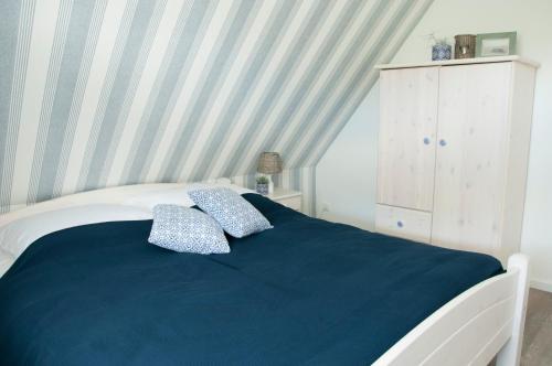 Postel nebo postele na pokoji v ubytování Haus Steuerbord