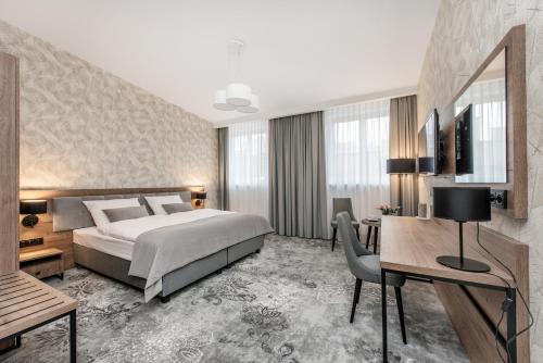 Ліжко або ліжка в номері Vinfort Aparthotel