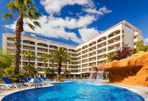 a resort with a pool and a water slide at H10 Salou Princess in Salou