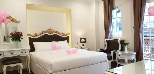 Katil atau katil-katil dalam bilik di Carita Hotel