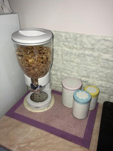 a food processor sitting on a table with three cups at Da Francesca in Scilla