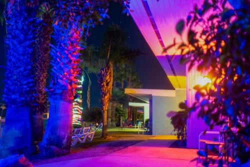 a room with purple and blue lights on a building at CCBC Resort Hotel - A Gay Men's Resort in Cathedral City