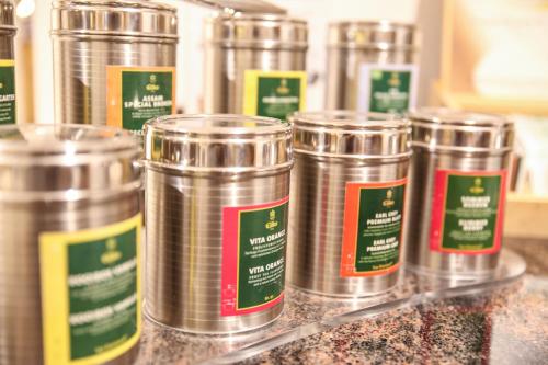 a row of tin cans sitting on a counter at Hotel Friedenseiche in Benediktbeuern