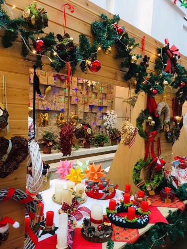 a room with a table with christmas decorations on it at Changchun Clear Moon Apartment by South Lake Hotel in Changchun