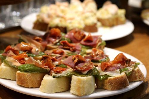 a plate of food with sandwiches on a table at Apartment Near Nanjing Road/ Jing'an Temple/ Renmin Plaza in Shanghai