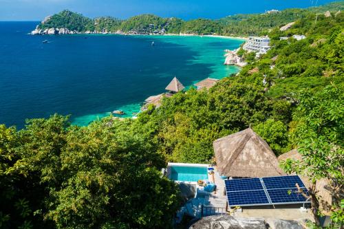 an aerial view of a resort with a view of the ocean at The Fisherman's Villas in Koh Tao