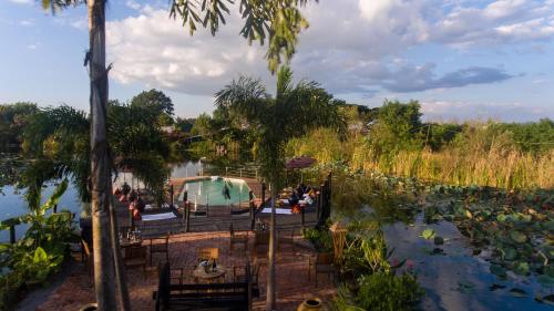 a group of people on a boat in a pond at ViewPoint Ecolodge in Nyaung Shwe