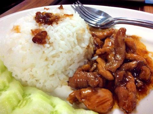 a plate of food with rice and a fork at EZ House in Sukhothai