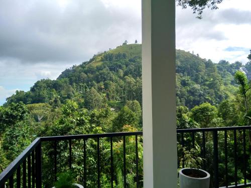 a balcony with a view of a mountain at Ever Green Mount in Ella
