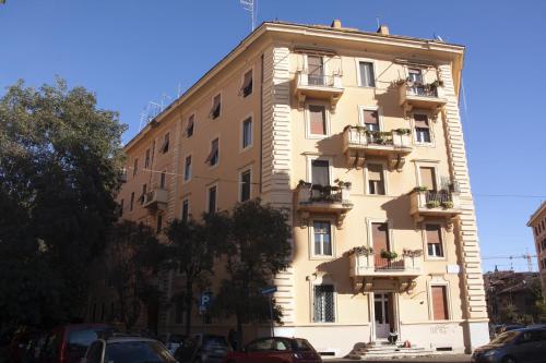 a large building with balconies on the side of it at Il Melograno Holiday House in Rome