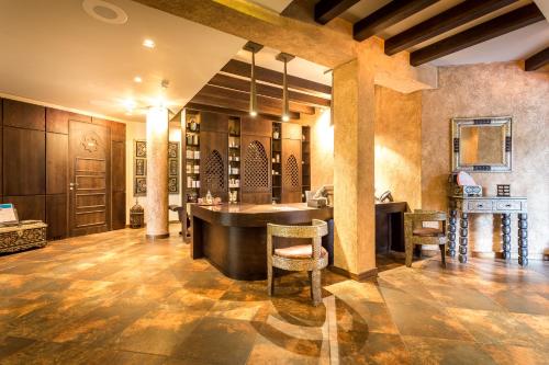 a tasting room with a table and chairs in a building at Thracian Cliffs Golf & Beach Resort in Kavarna