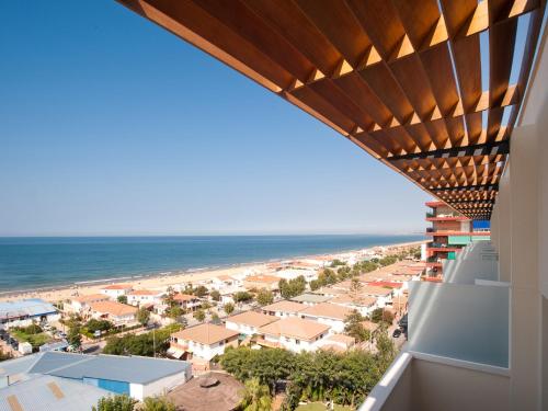 a view of the beach from the balcony of a condo at Pato Amarillo in Punta Umbría