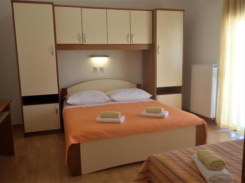 Postel nebo postele na pokoji v ubytování Apartments Pjer