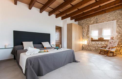 Postel nebo postele na pokoji v ubytování Country House Sa Serra