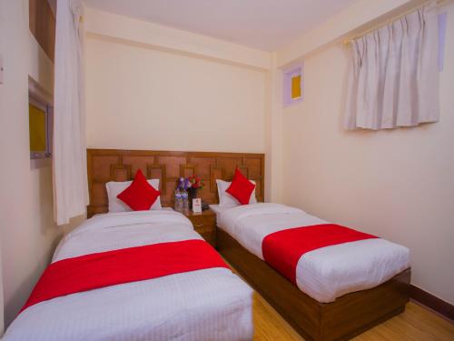Cama o camas de una habitación en Durbar Guest House
