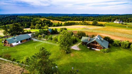 an aerial view of a house on a green field at Polana in Lipowiec