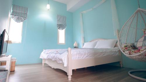 Katil atau katil-katil dalam bilik di Flying in Sunny Day B&B