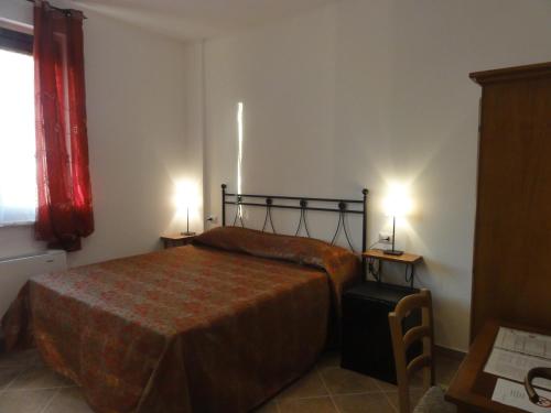 Katil atau katil-katil dalam bilik di Agriturismo Casa Rosa