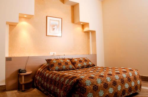 a bedroom with a bed in a room at Marble Tower in Beirut