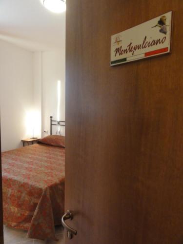 a door leading to a bedroom with a bed at Agriturismo Casa Rosa in Offida