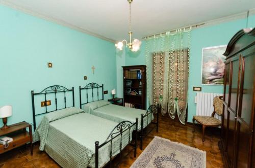 A bed or beds in a room at B&B La Volpara
