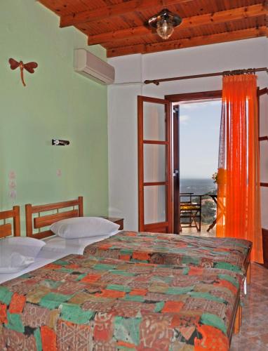 Una cama o camas en una habitación de Pension Andromeda