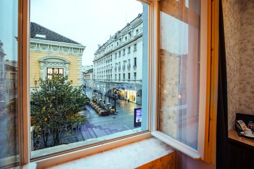 a window with a view of a city street at Maison Royale in Belgrade