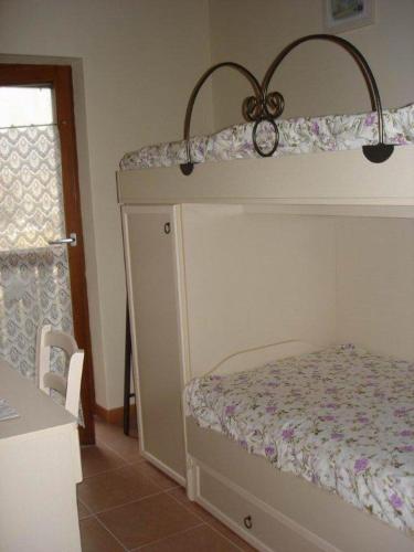 Postel nebo postele na pokoji v ubytování Residence La Pineta
